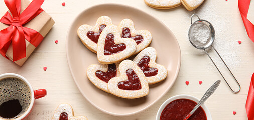 Composition with tasty heart-shaped cookies for Valentines Day on light background, top view