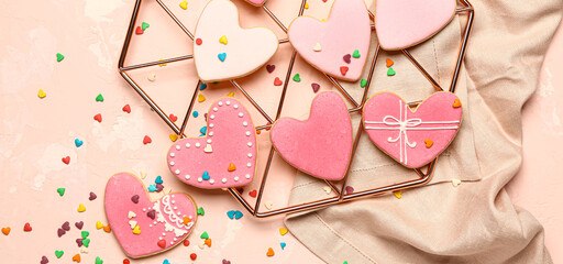 Tasty heart-shaped cookies for Valentines Day on beige background, top view