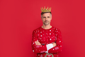 Winter man in crown. Man in Christmas santa sweater, winter holiday, christmas background.