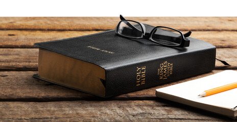 Black christian holy bible on wooden table