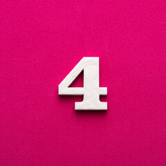Number four - white number in wood on rhodamine red background