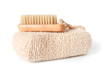 Soft shower sponge and wooden massage brush on white background