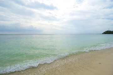 Tropical Beach, Wave and Blue Sea Water. This photo was taken on one of the tropical islands in Kotabaru, Indonesia.