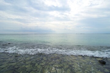 Tropical Beach, Rock, Wave and Blue Sea Water. This photo was taken on one of the tropical islands in Kotabaru, Indonesia.