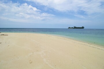 Tropical Beach, Wave and Blue Sea Water. This photo was taken on one of the tropical islands in Kotabaru, Indonesia.