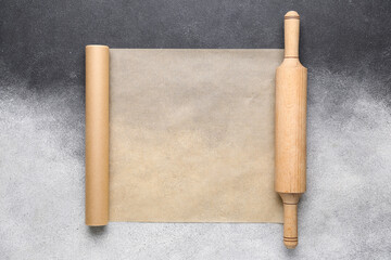 Roll of baking paper and rolling pink on black and white background