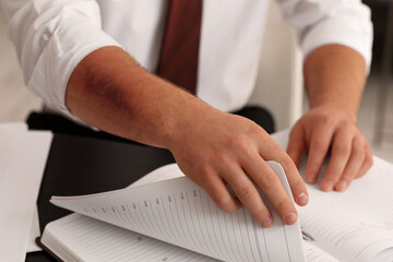 Man with bruise on arm working in office, closeup