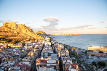 People walking on the Paseo Maritimo in the touristic city of Alicante in Spain in 2022.