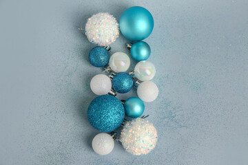 Set of beautiful Christmas balls and sequins on color background