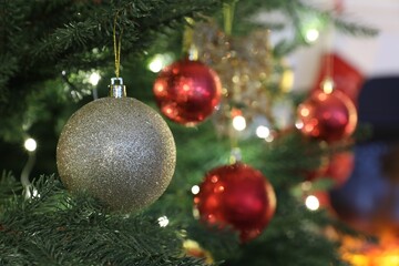 Beautifully decorated Christmas tree with bauble, closeup. Space for text