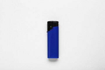 Stylish small pocket lighter on white background, top view