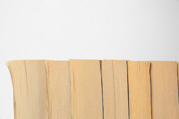 Collection of different books on light background, space for text