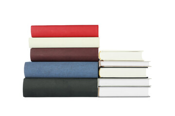 Many different books stacked on white background