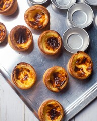 Delicious egg tart on tray, Portugese custard egg tart or Pastel de nata, Hong Kong tart egg straight out from oven.
