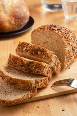 Healthy wholemeal bread on wooden table.