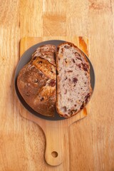 Walnut cranberry raisin dried fruit sourdough bread. Sourdough bread close up texture.