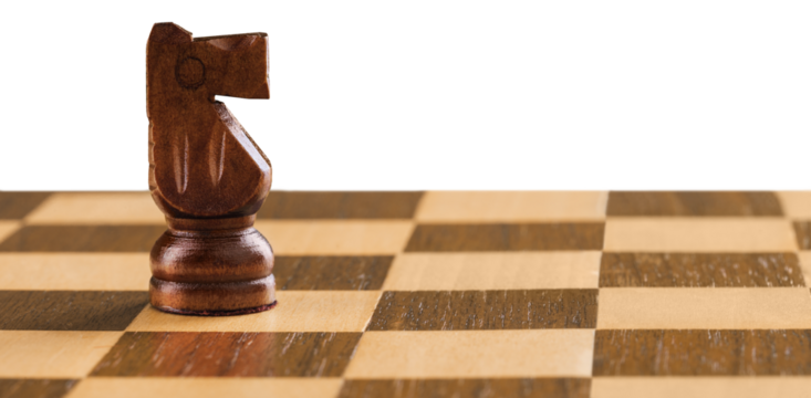 Wooden chess figures on a classic chessboard