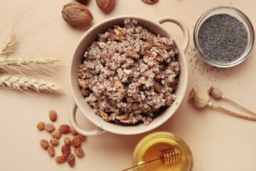 Cooking pot of Kutya and ingredients on beige background