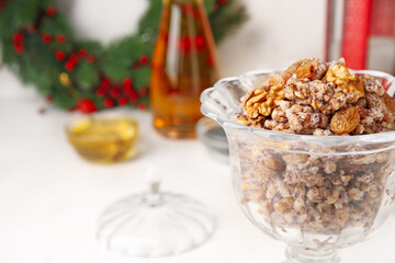 Glass bowl of Kutya on white table, closeup