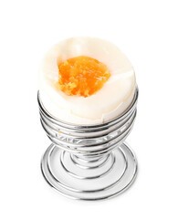 Soft boiled egg in holder on white background