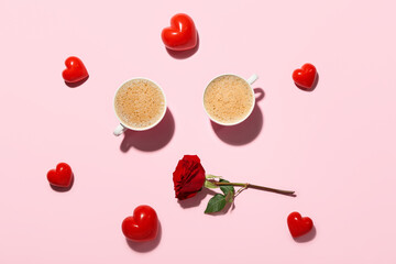 Cups of latte with hearts and rose on pink background. Valentine's Day celebration