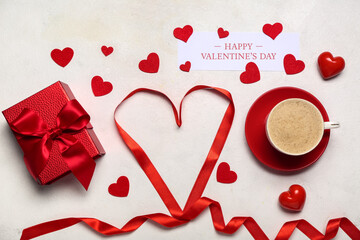 Card with text HAPPY VALENTINE'S DAY, cup of latte, gift and hearts on white background