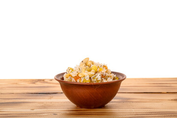 Fototapeta na wymiar Bowl of rice Kutya on table against white background
