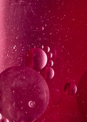 Abstract gradient blurred background in red tones. Geometric shapes balls of different sizes. fantastic picture of space. Vertical macro photo, selective focus 