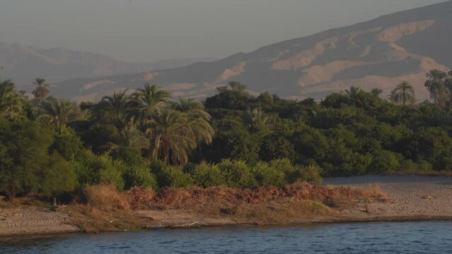 Massive Desert Mountain and Lush Green Farms in the Nile River, Egypt