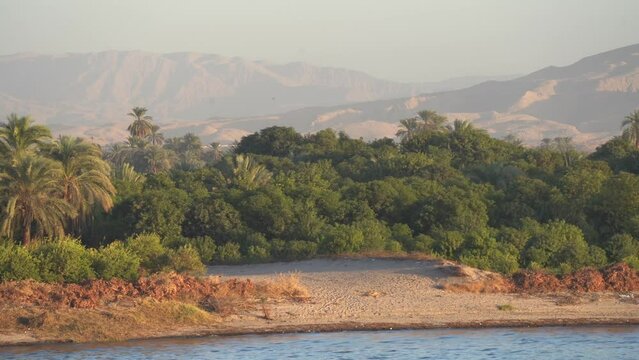 Beautiful shot of Nile River Bank and Sahara Desert Mountain