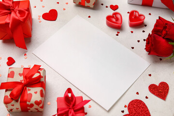 Blank letter with candles, hearts and gifts on white background. Valentine's Day celebration