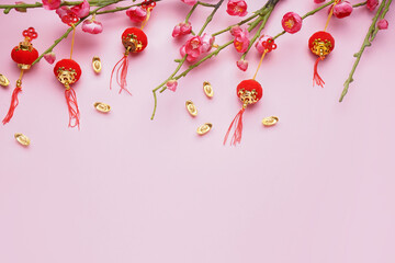 Beautiful sakura and Chinese symbols on pink background. New Year celebration