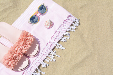 Stylish beach accessories on sand outdoors, top view. Space for text