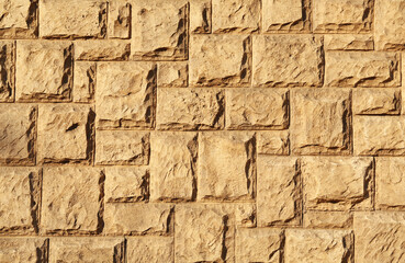 Texture of beautiful light brown stone wall as background
