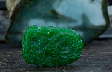 Real jade is jade carved in the form of a green dragon. It's an expensive piece of jewelry.