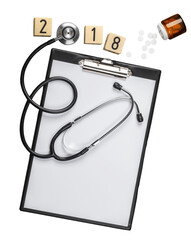 Medical stethoscope and blank paper with tablets