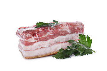 Piece of pork fatback and parsley isolated on white