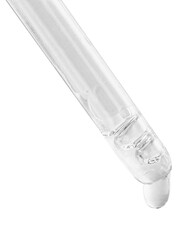 A drop falls from a glass pipette