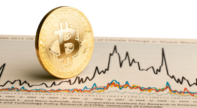 Physical version of cryptocurrency Bitcoin on newspaper