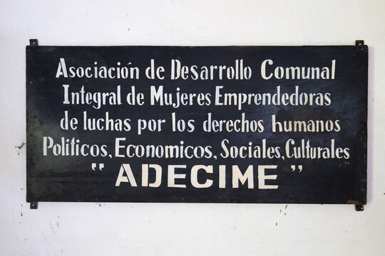 La Labor, El Salvador - October 27, 2022 - Sign that Reads Association of Integral Communal Development of Women Entrepreneurs Fighting for Political, Economic, Social and Cultural Human Rights