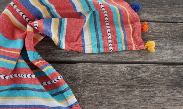 Serape Folded Around Top and Left Side of Wood Panesl