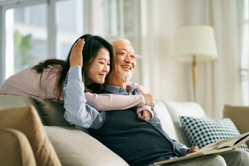 asian elderly father and adult daughter having a good time - obrazy, fototapety, plakaty