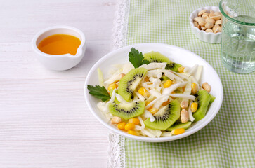 Fresh vegetables salad with kiwi