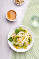 Fresh vegetables salad with kiwi