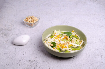 Fresh vegetables salad with kiwi