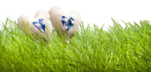 Textile handmade heart on green grass