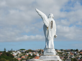back shot of an angel sculpture with one wing