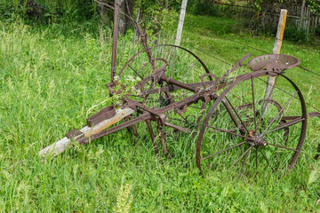 rusty antique cultivator 