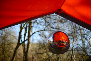 Shiny disco ball or mirrorball, outdoor party with mirror disco ball