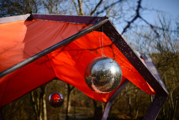 Shiny disco ball or mirror ball, outdoor party with mirror disco ball